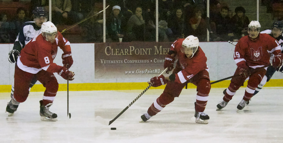 Defensive duo Ryan McKiernan and Vincent Barnard steer the puck to safety. (Remi Lu / McGill Tribune)