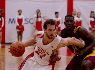 Forward Aleksandar Mitrovic drives past a Laval defender. (Luke Orlando / McGill Tribune)