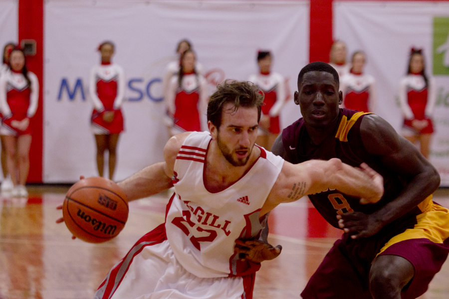 Forward Aleksandar Mitrovic drives past a Laval defender. (Luke Orlando / McGill Tribune)