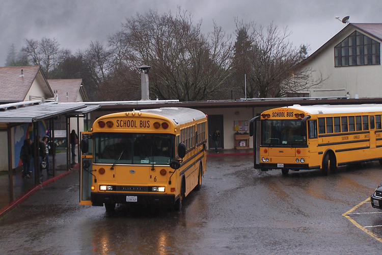 School bus pulling up to school